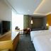 Richmond Hotel Premier Sendai Ekimae room with two beds, desk, sofa, and city-view window