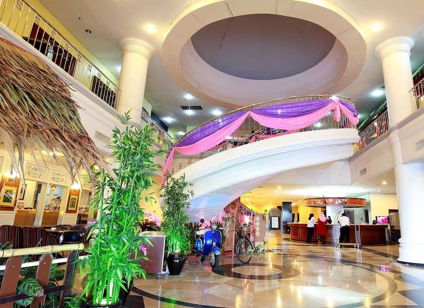 The Putra Regency Hotel in Kangar lobby with curved balcony, columns and decorative lighting