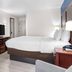 Comfort Inn Greenville - Haywood Mall guest room with bed, TV, wardrobe, and desk in Greenville