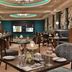 Westville Hotel Enniskillen dining room with set tables, leather seating and mirrored ceiling lights
