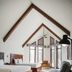 Hôtel Lac Carling Golf & Spa guest room in Grenville with vaulted ceiling, two beds, and sofa seating