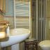 Il Borgo di Campi bathroom in Riomaggiore with sink, toilet, shower, and towel warmer
