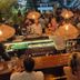 Be Playa Hotel Boutique & Rooftop Bar in Playa del Carmen, lively rooftop bar with hanging lights and guests at the counter