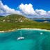 Concordia Eco Resort in St. John with turquoise bay, sailboat, and lush hillside coastline