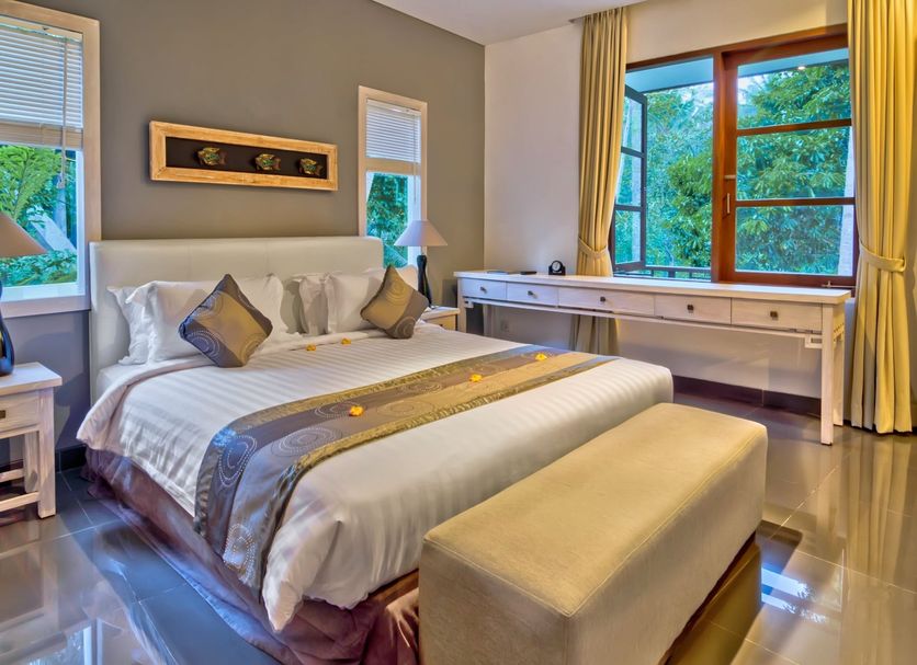 Labak River Hotel By Eps, Ubud: bright guest room with king bed, desk, and jungle-view windows
