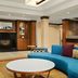 Fairfield Inn and Suites by Marriott Weirton lobby with blue sectional seating and fireplace