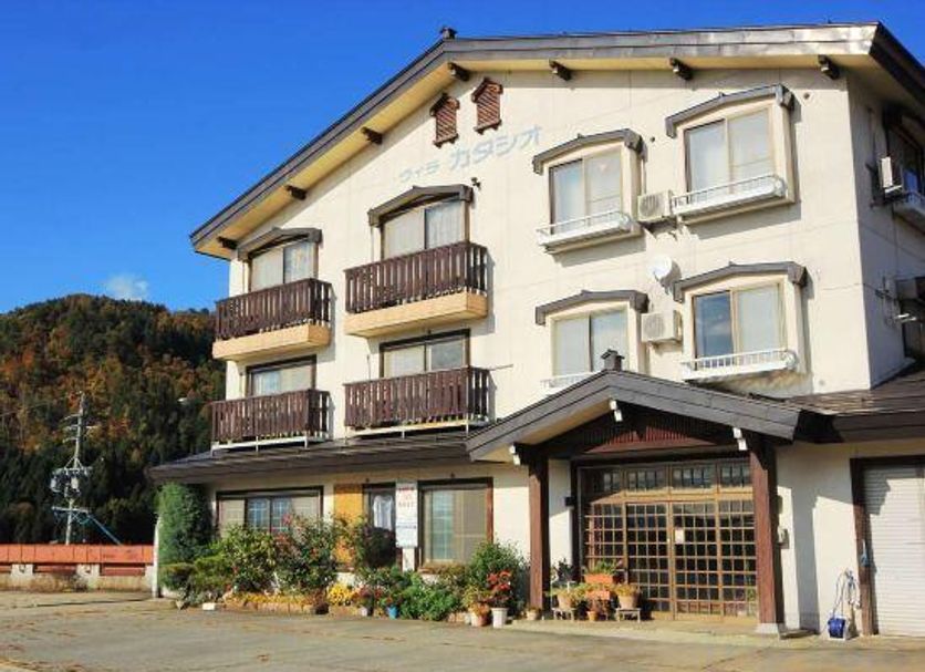 Villa Katashio in Nozawa Onsen, a three-story hotel with balconies and a sloped roof