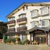 Villa Katashio in Nozawa Onsen, a three-story hotel with balconies and a sloped roof