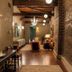 Hotel Cleo, Knoxville Downtown, a Tribute Portfolio Hotel hallway with brick walls and wood beams
