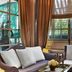 Le Dokhan's, Paris Arc de Triomphe, a Tribute Portfolio Hotel lounge with armchairs, window and curtains in Paris