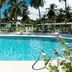 All Seasons Resort - Europa in Holetown: tropical pool with cabanas, palm trees and clear blue water