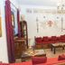 Spot Hotel Rhodes lounge with red sofas, wooden tables, wall art and chandelier