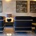 La City Estación in Alicante lounge with black leather chairs, lamp and wall art