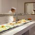 Christofinia Hotel in Ayia Napa buffet counter with assorted salads and a chef in the background