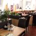 Hotel & Restaurant Wilhelm von Nassau in Diez: bright dining room with tables, chairs and plants