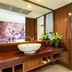 Dang Derm Khaosan Bangkok bathroom with vessel sink, wood vanity, mirror, and shower room