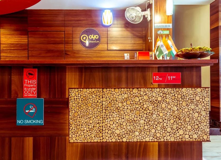 OYO 1594 Hotel Landmark reception desk in Visakhapatnam with wooden paneling and no smoking signs