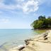 Seashell Resort Krabi in Krabi with beachfront rocks, clear sea, and a tree-lined shore