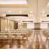 Hilton Frankfurt Gravenbruch in Neu Isenburg ballroom with rows of banquet tables and chairs