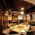 Welcome Hotel at Srinagar restaurant with wooden ceiling, set dining tables and cushioned chairs