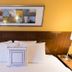 Fairfield Inn by Marriott Orangeburg guest room bed with framed wall art and bedside lamps