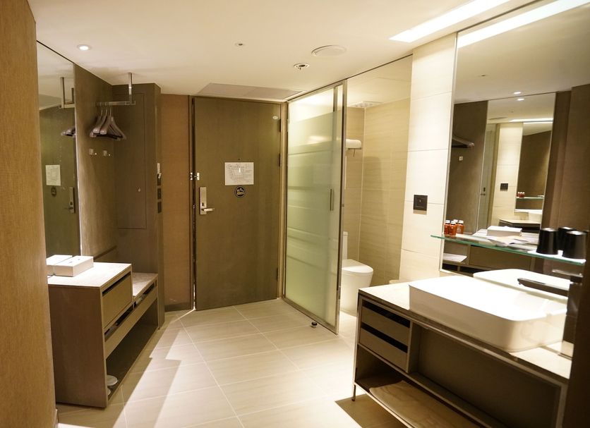 Hotel Midtown Richardson Taipei City bathroom with double vanity, shower and toilet
