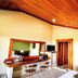 Hotel Montaña Monteverde room in Santa Elena with wood ceiling, desk, mirror and twin beds