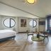 Leonardo Hotel Ijmuiden Seaport Beach room with round windows, sitting area and sea view in IJmuiden