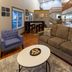 Paynesville Inn And Suites in Paynesville lobby seating area with sofa, armchair, coffee table and staircase