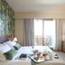 Relais Le Betulle guest room in Conegliano with bed, balcony doors, and breakfast tray