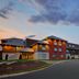 Holiday Inn Express Nashville Airport by IHG exterior at dusk with covered entrance and driveway