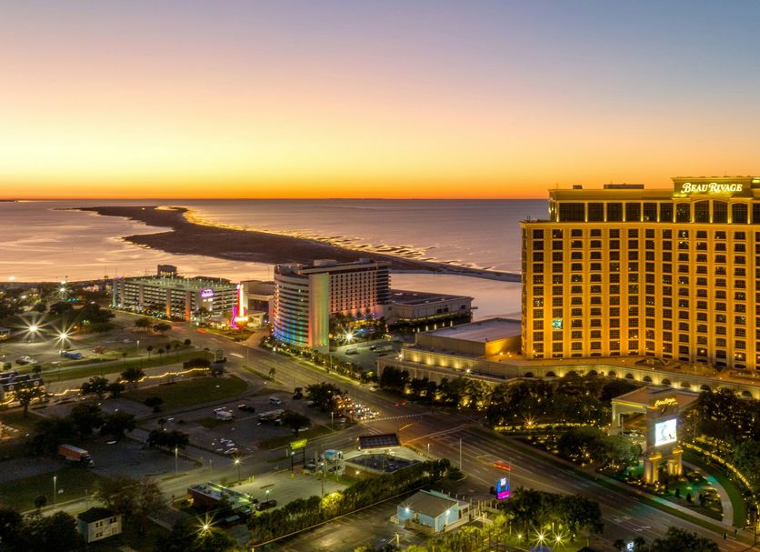 Beau Rivage Resort and Casino in Biloxi at sunset with Gulf Coast oceanfront and city lights