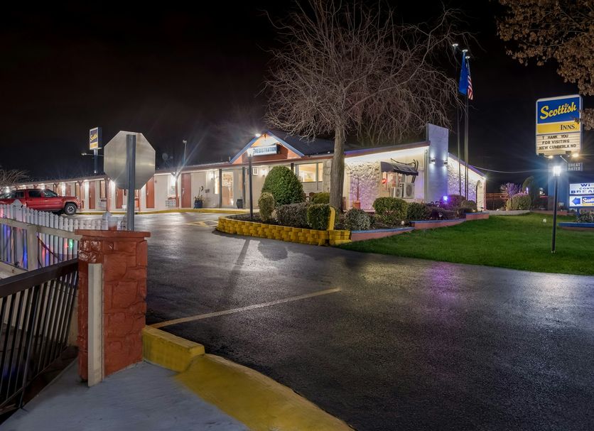 Scottish Inns Harrisburg-Hershey South in New Cumberland, exterior at night with lit parking lot and sign