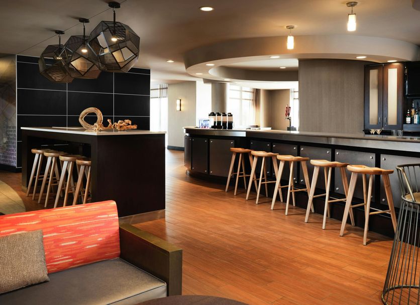 SpringHill Suites by Marriott Minneapolis-St. Paul Airport/Mall of America lobby bar in Bloomington with stools and lounge seating