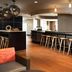 SpringHill Suites by Marriott Minneapolis-St. Paul Airport/Mall of America lobby bar in Bloomington with stools and lounge seating