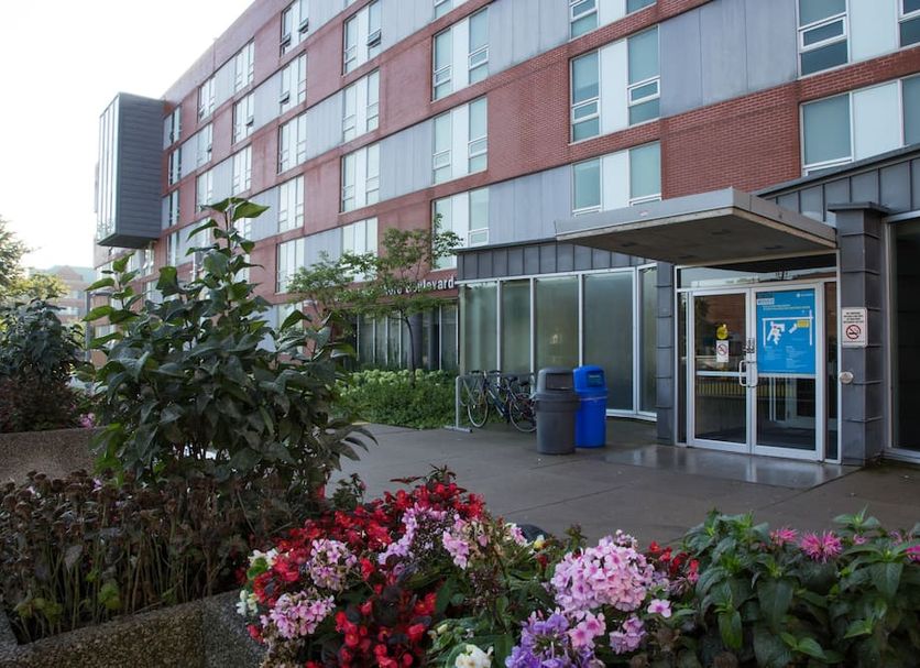 Humber College Lakeshore Residence in Toronto entrance with flower beds and bike racks