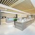 Ji Hotel Guiyang Fountain lobby with reception counter, seating, and modern minimalist interior