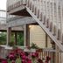 The Inn on Pamlico Sound in Buxton with wooden decks, stairs, and flower planters