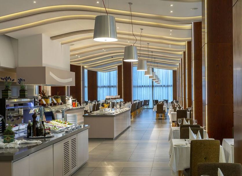 Melissi Beach Hotel & Spa in Ayia Napa buffet restaurant with modern dining area and pendant lights