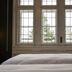Boutique Hotel Waldhaus in Birsfelden, room with bed and large window view