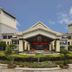 Wonderland Hotel Luxury in Hangzhou, grand hotel entrance with landscaped gardens and covered driveway