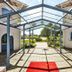 Sturup Airport Hotel in Sturup entrance walkway with glass canopy and red carpet leading to the courtyard