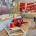 ibis El Jadida lounge with wooden tables, red accents and café seating in El Jadida