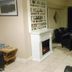 Lahinch Hostel lounge in Lahinch with black chairs and a fireplace