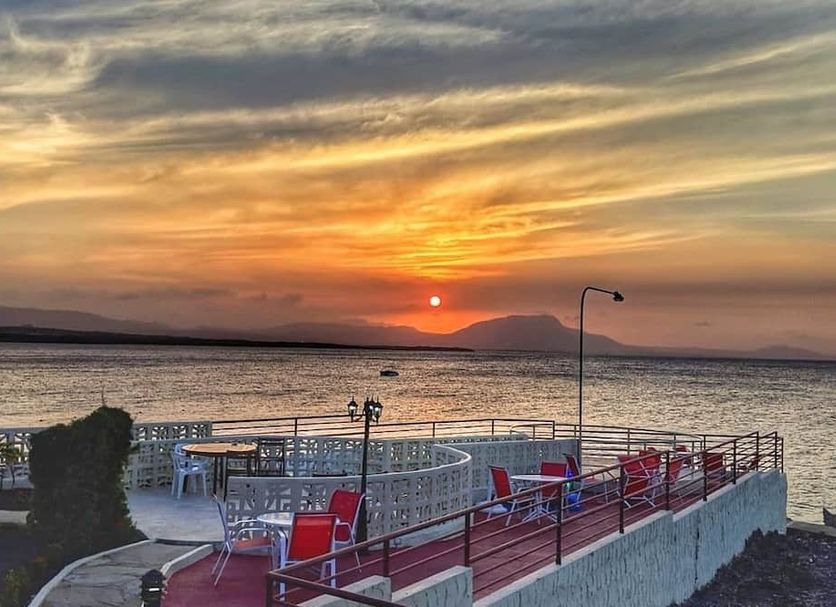Sosua By The Sea in Sosúa with oceanfront terrace and sunset view over the water