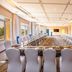 Golden Tulip Canaan Kampala meeting room in Kampala with U-shaped conference table and white chairs