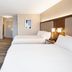 Holiday Inn Express Nashville Airport in Nashville: guest room with two beds, TV, and bedside lamps
