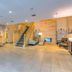 Country Inn & Suites by Radisson, Crystal Lake, IL lobby with staircase, front desk and seating area