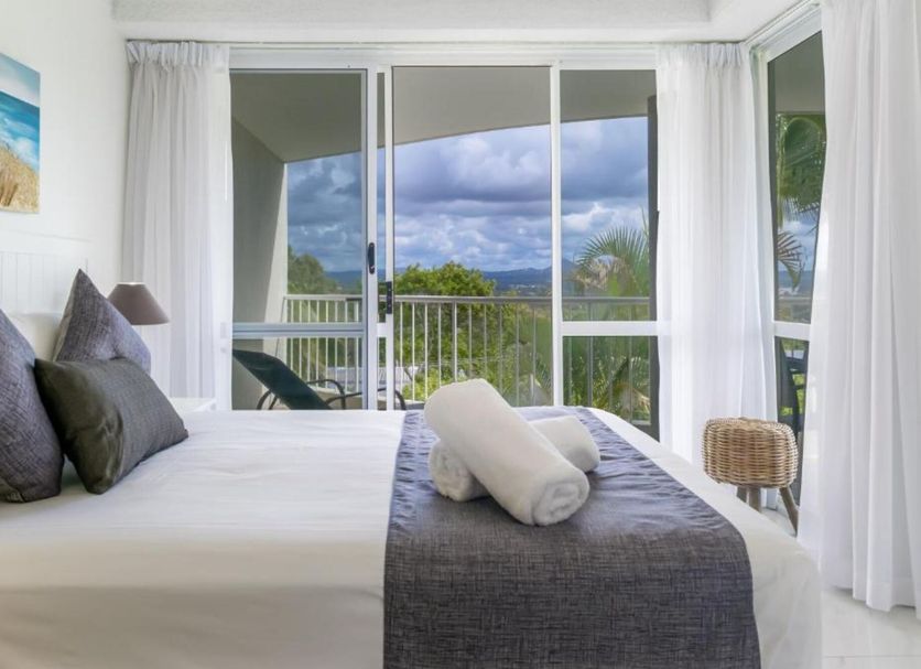 Noosa Hill Resort in Noosa Heads bedroom with balcony and ocean or lagoon views