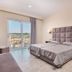Mavrikos Hotel in Tsilivi: guest room with bed, balcony doors, and distant sea view